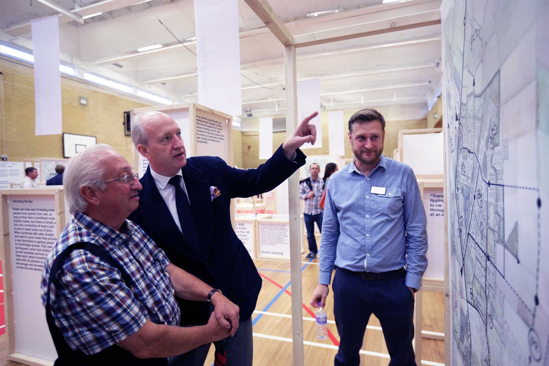 3 men looking at Waterbeach plans