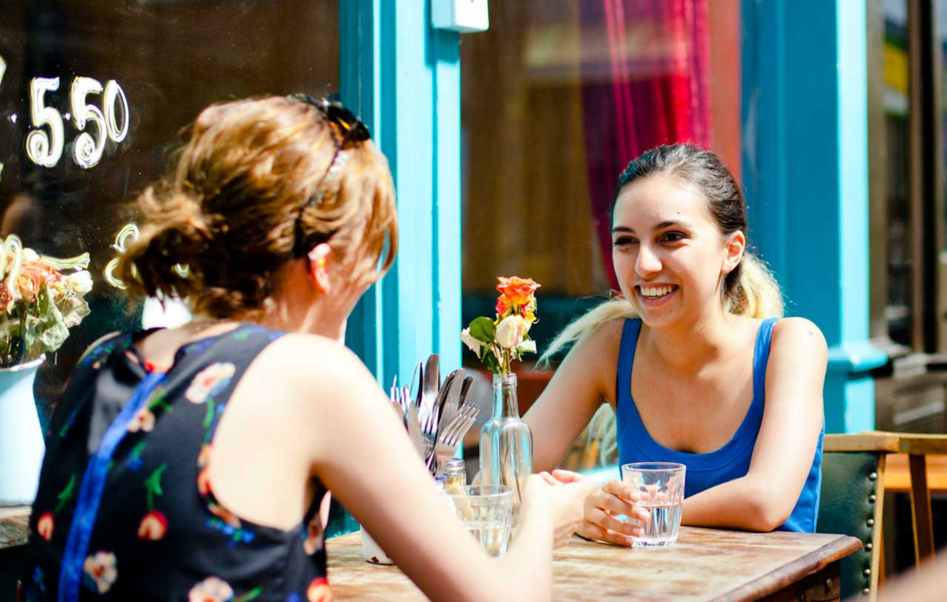 Two women talking in a cafe