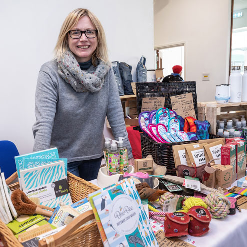Woman standing at her stall at Waterbeach Community Market