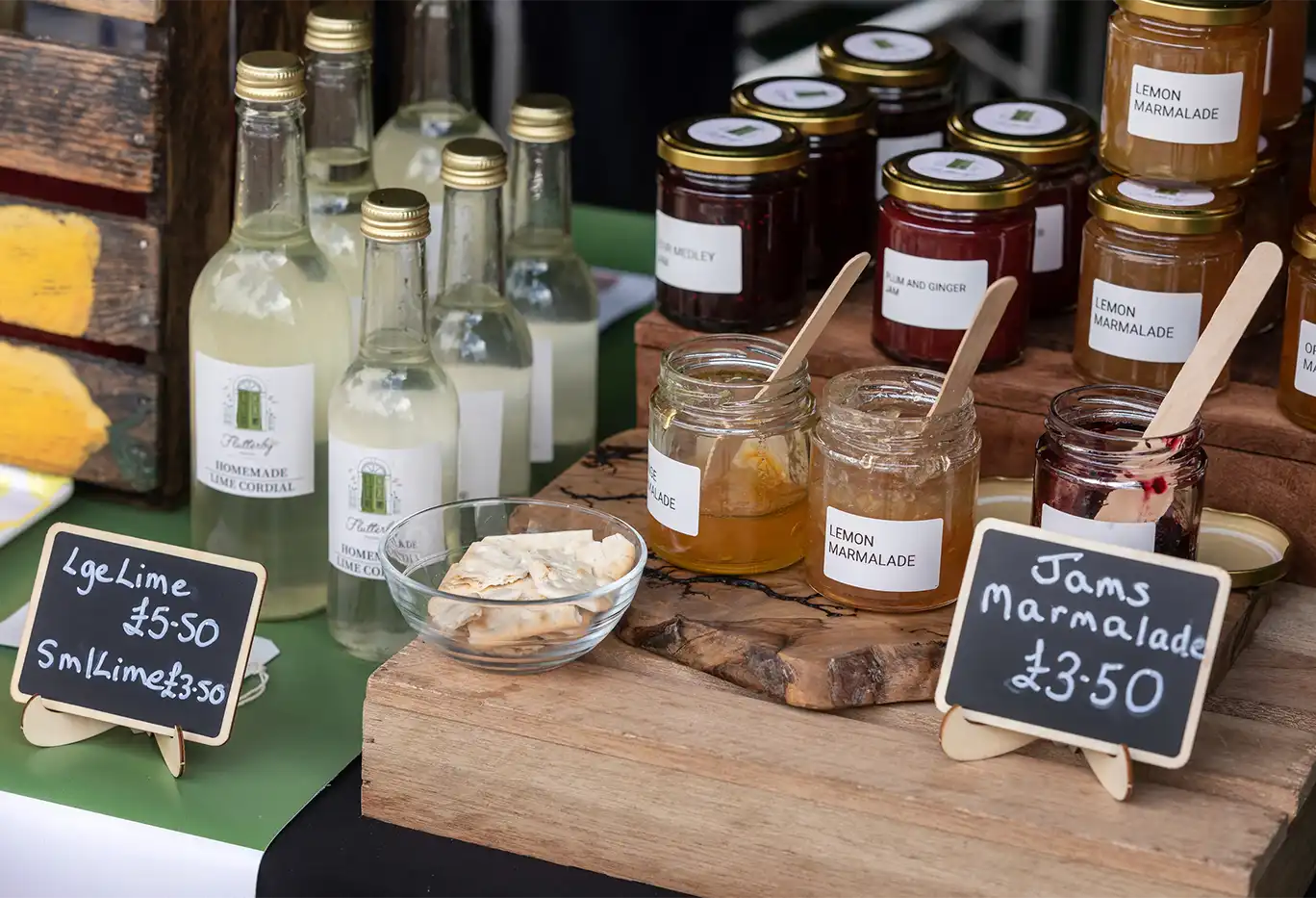 Jams and cordials on a wooden market table