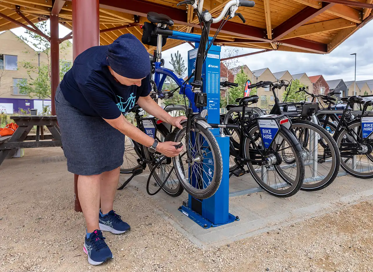 Woman with bike at Waterbeach Active Travel Hub