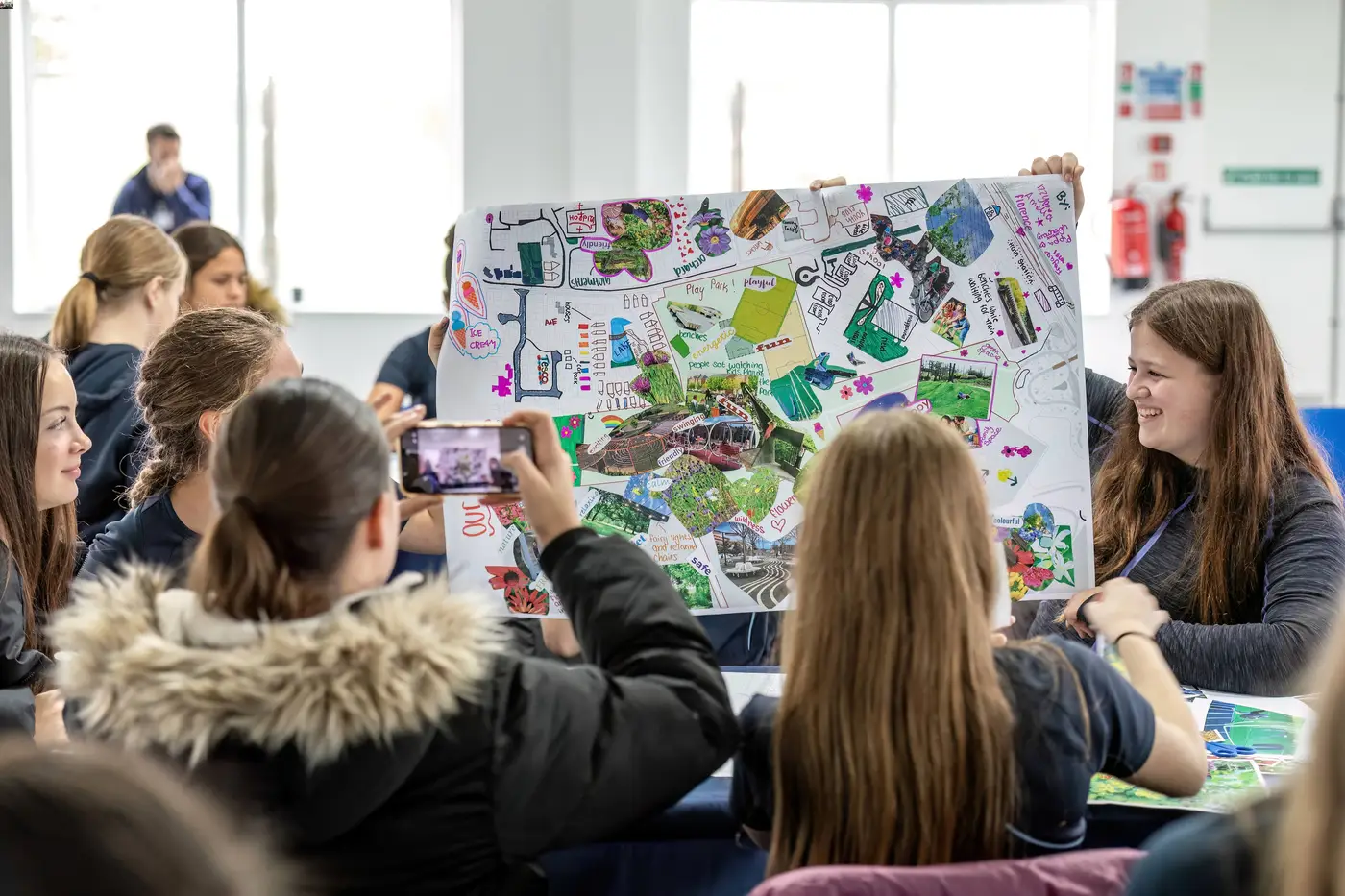 Teacher showing students board about climate change