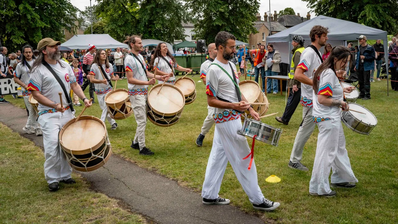 A parade of people playing the drums