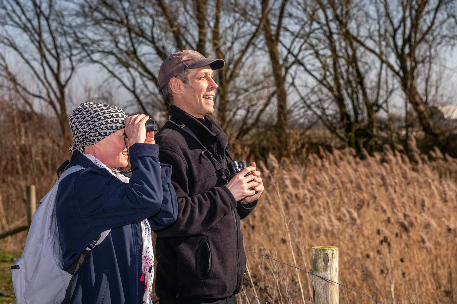 Two people bird watching at Waterbeach Lake
