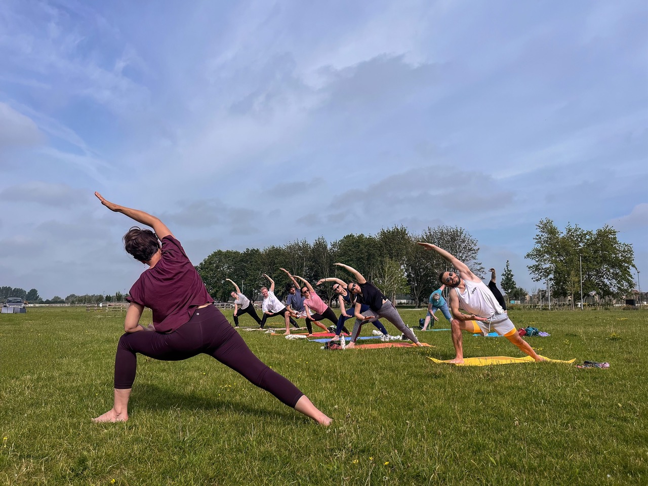 People doing yoga outside